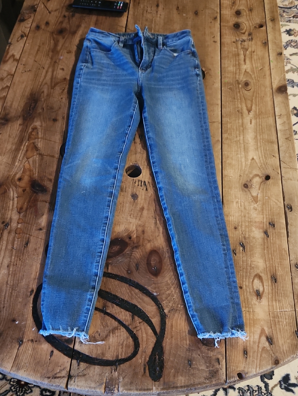 American Eagle Outfitters light blue skinny jeans with frayed hem